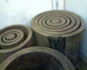 Solid Black Walnut logs cut concentrically @ 1 1/2" thick then kiln dried to 6-8% and ready to finish to tolerance.