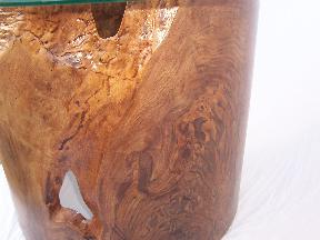 Close-up of swirly grain in this black walnut burl table with natural edges and inclusions.